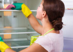 woman cleaning refrigerator